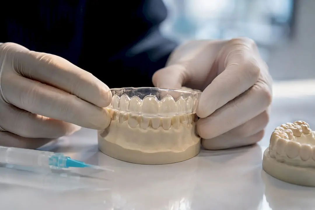 Clinician checking custom whitening tray fit